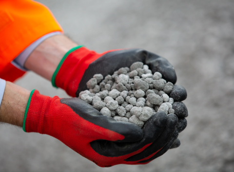 Hands holding aggregate
