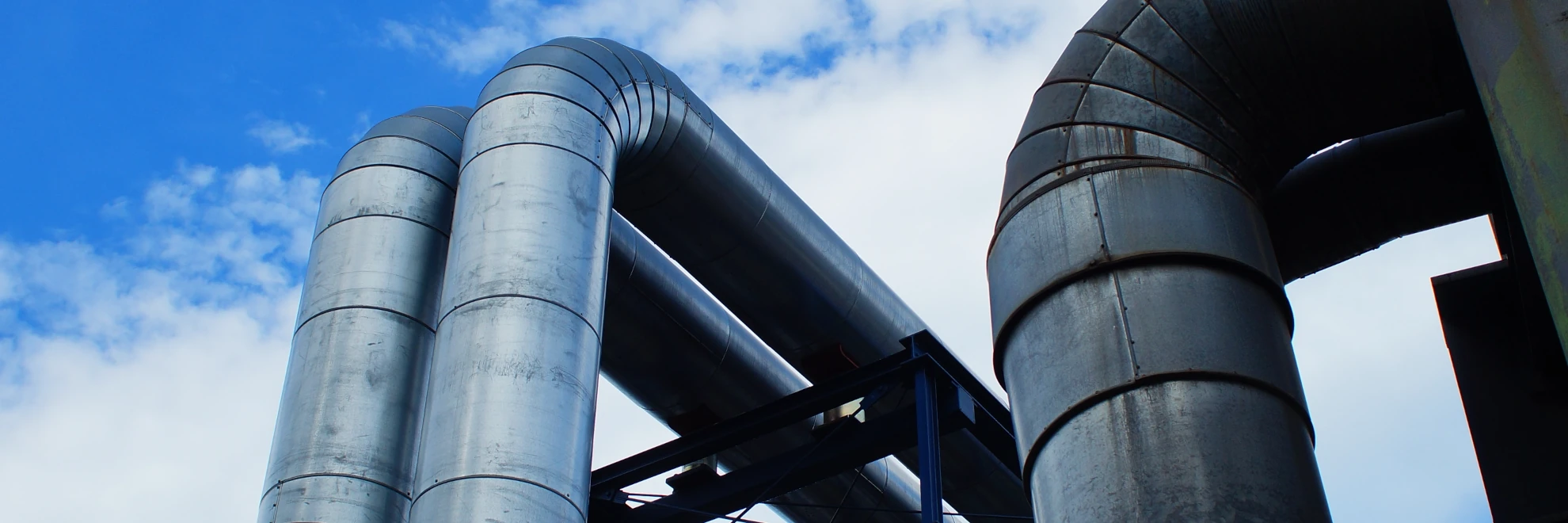 Pipes in front of a skyline